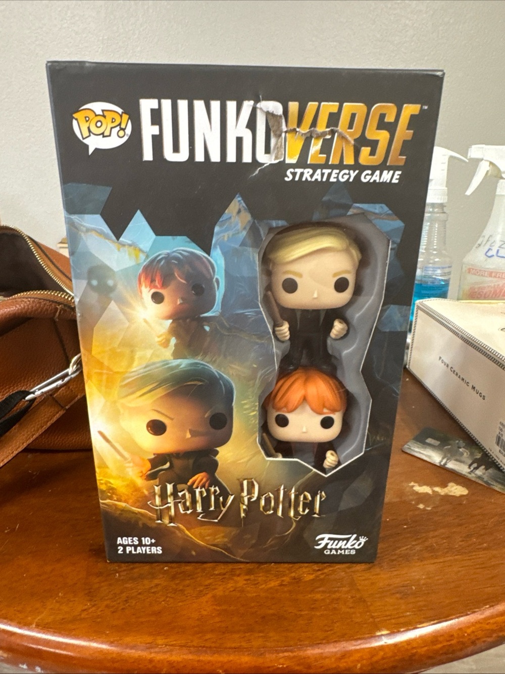 Funko Pop! FunkoVerse Harry Potter Strategy Game with Blonde and Orange Figures.